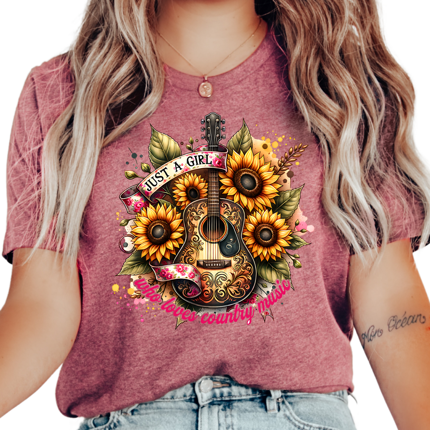 a woman wearing a pink shirt with sunflowers on it