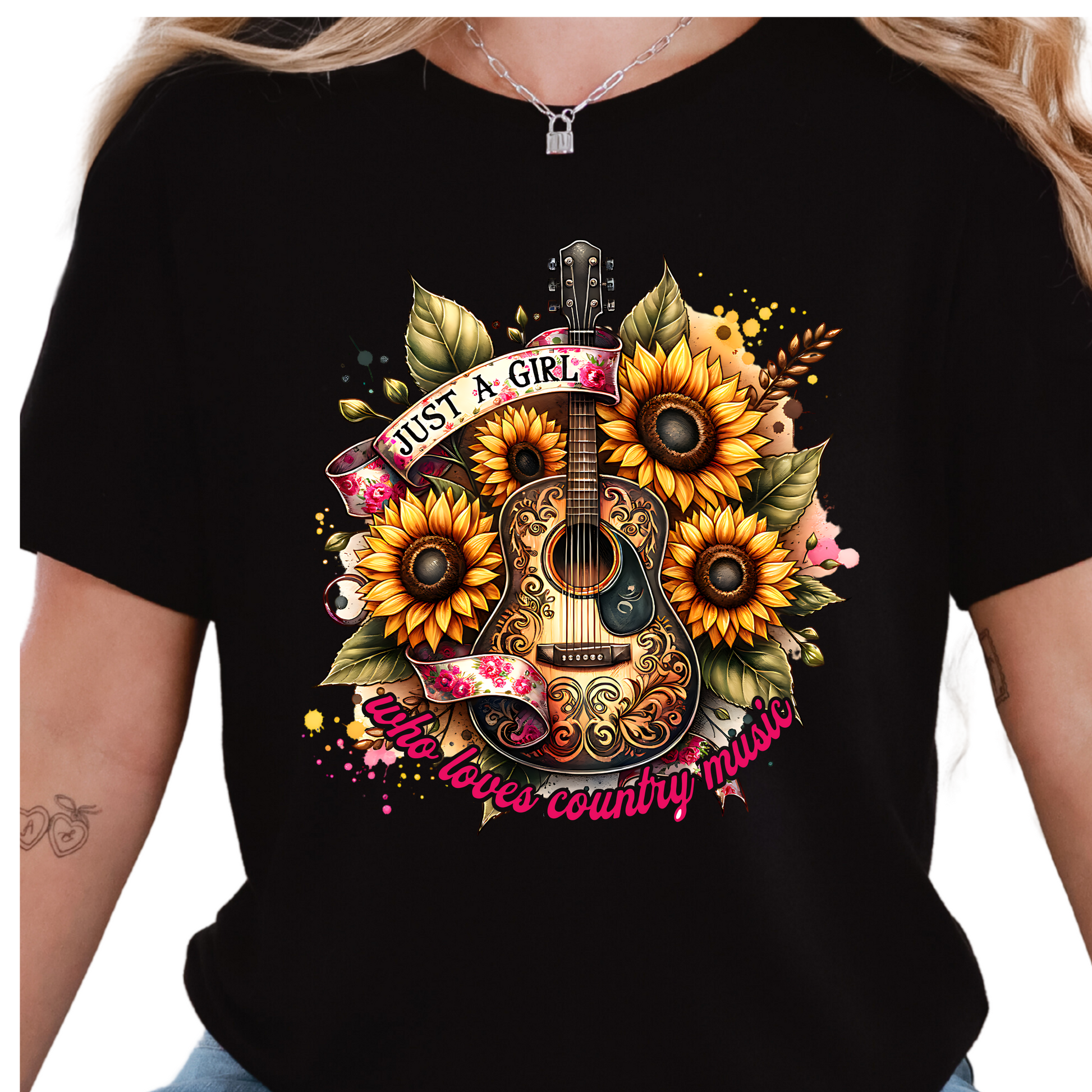 a woman wearing a black shirt with sunflowers and a guitar